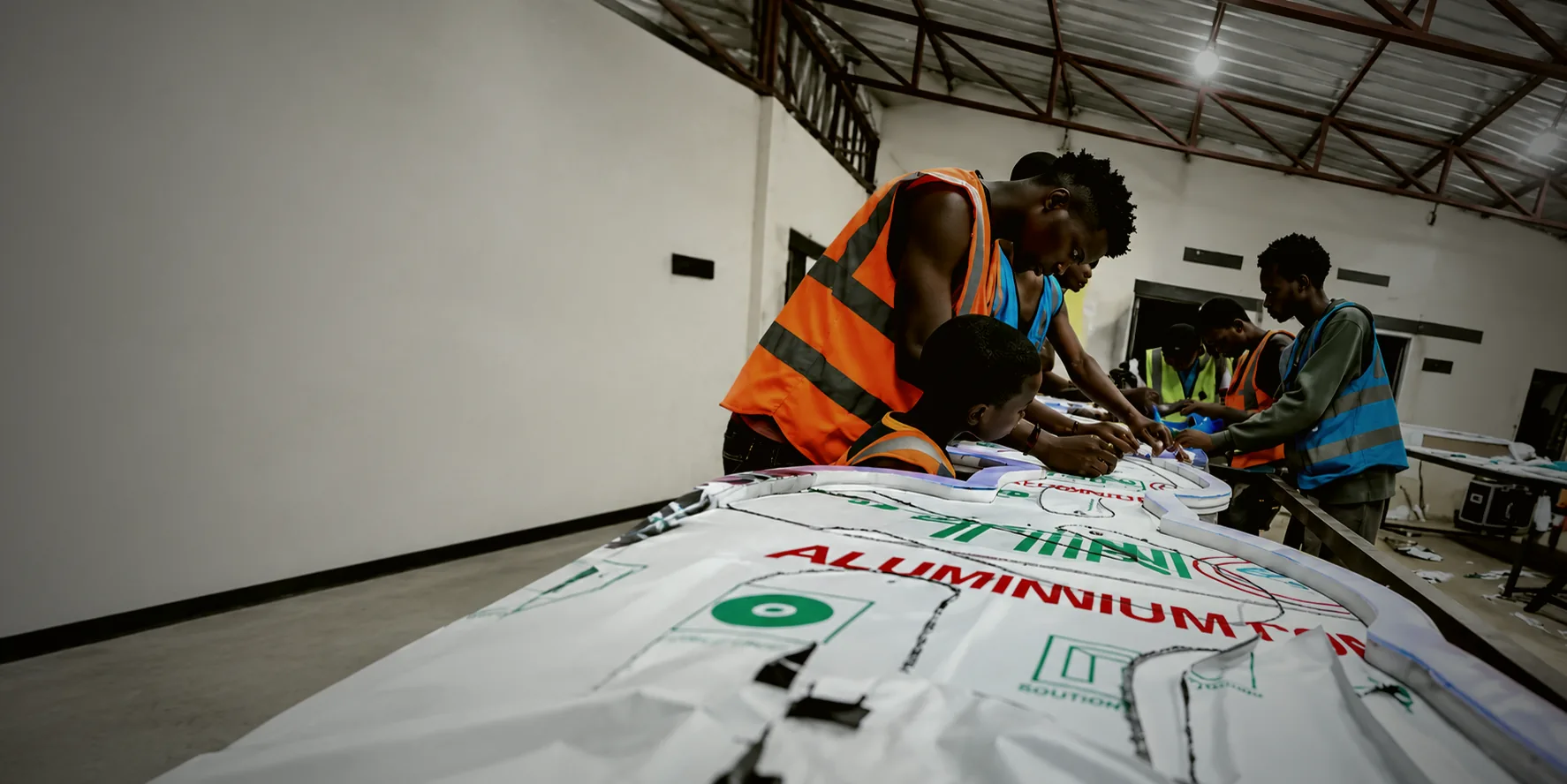 KreatKingz Art makers assembling illuminated signage in the workshop